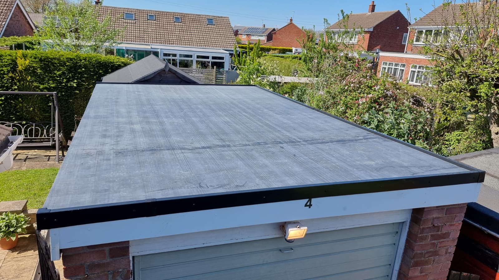 Completed garage flat roof with trim and edging