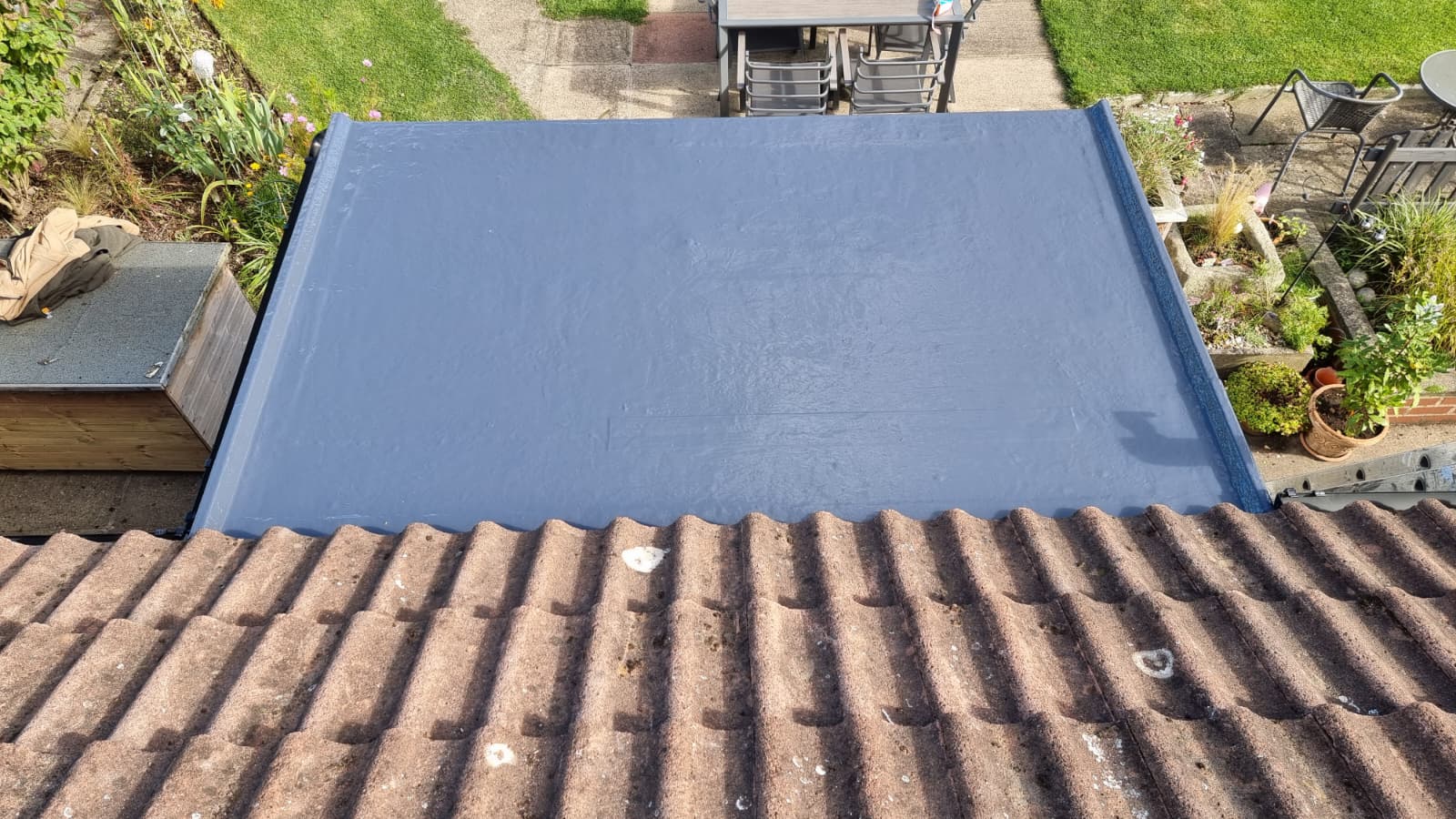 Newly installed flat roof with blue EPDM membrane