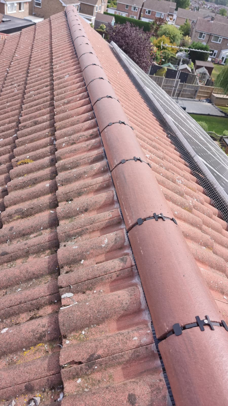 New dry ridge cap system fitted alongside solar panels