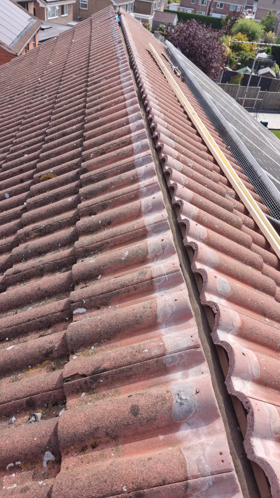 Completed dry ridge system on tiled roof
