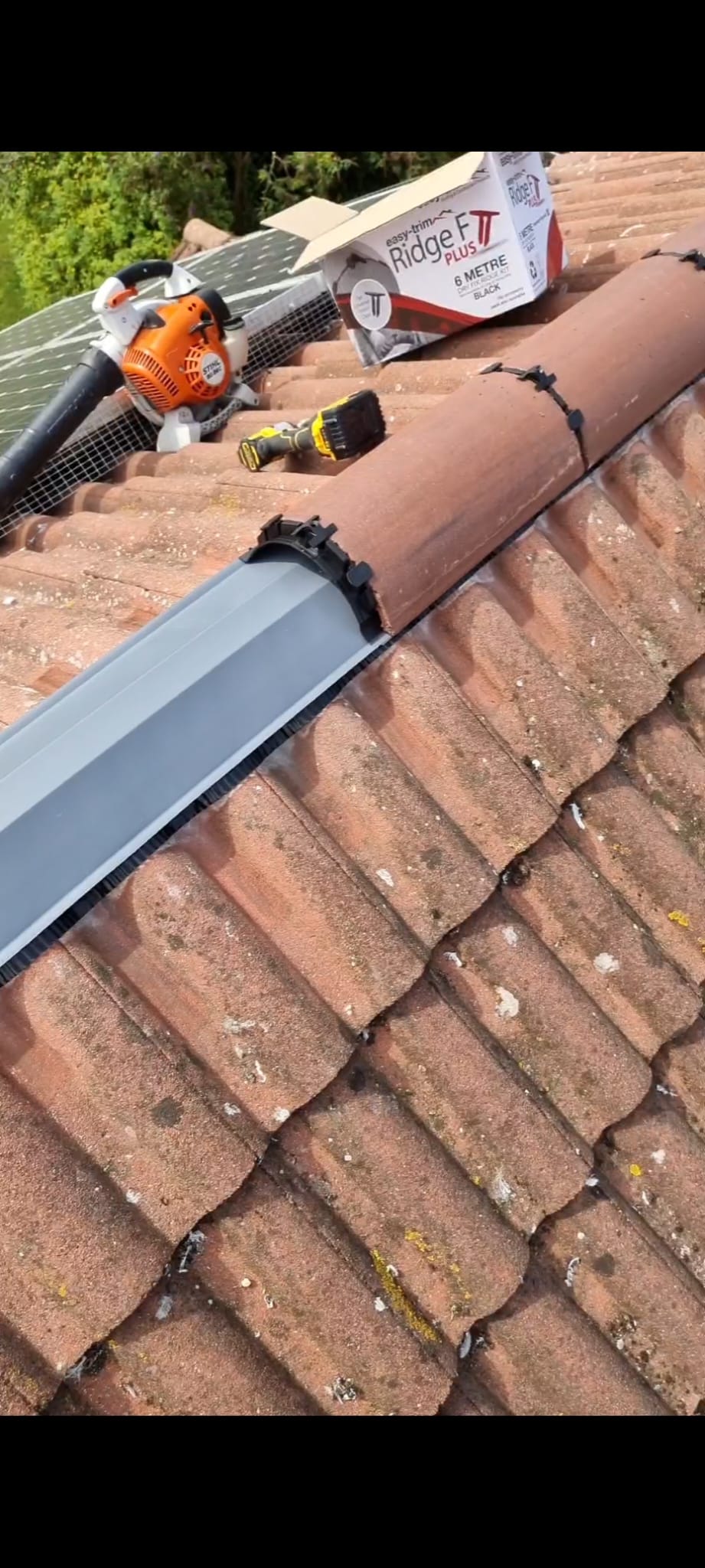 New ridge batten and felt roll along roof apex