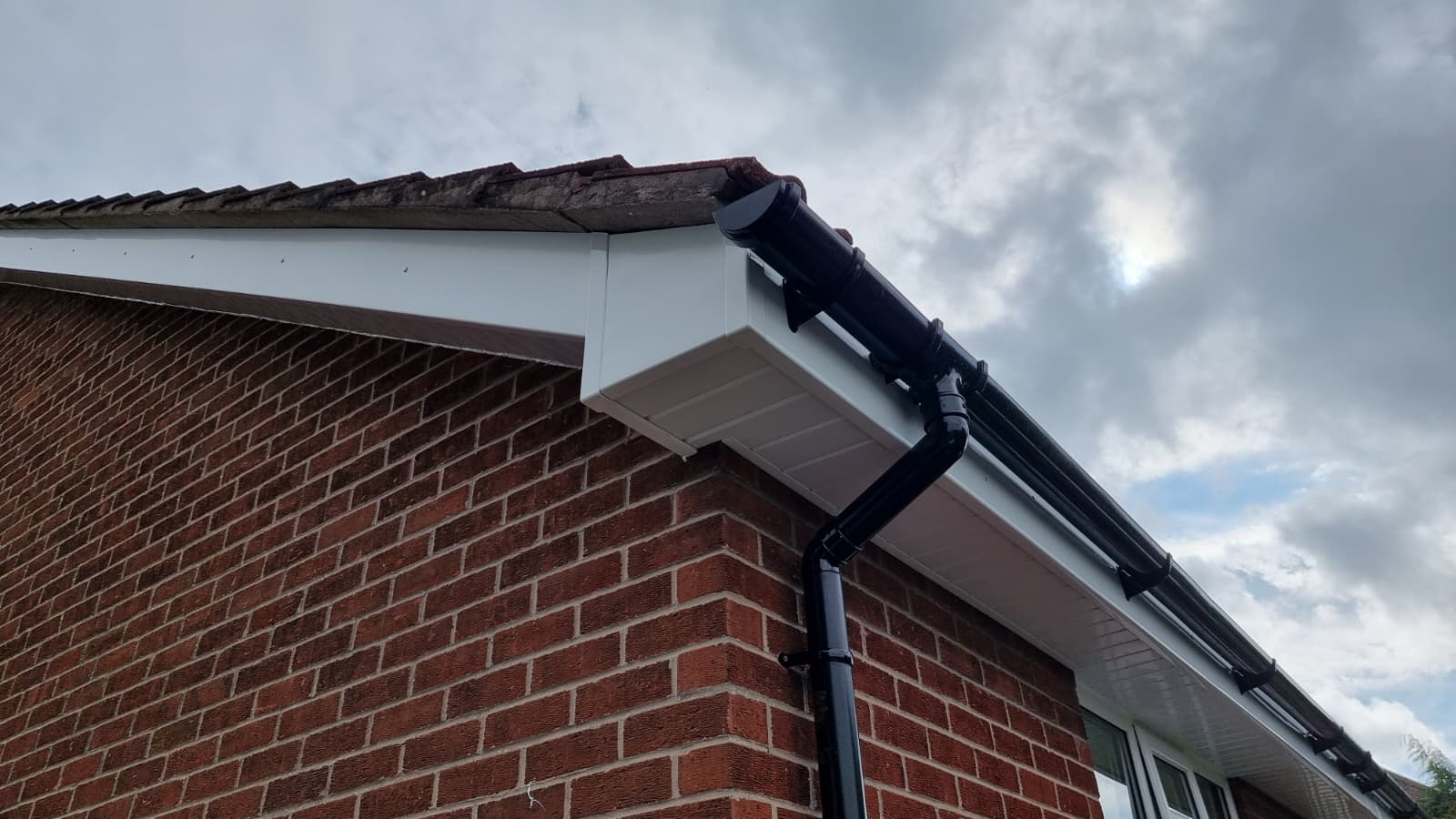 New fascias and soffits with brown guttering on bungalow