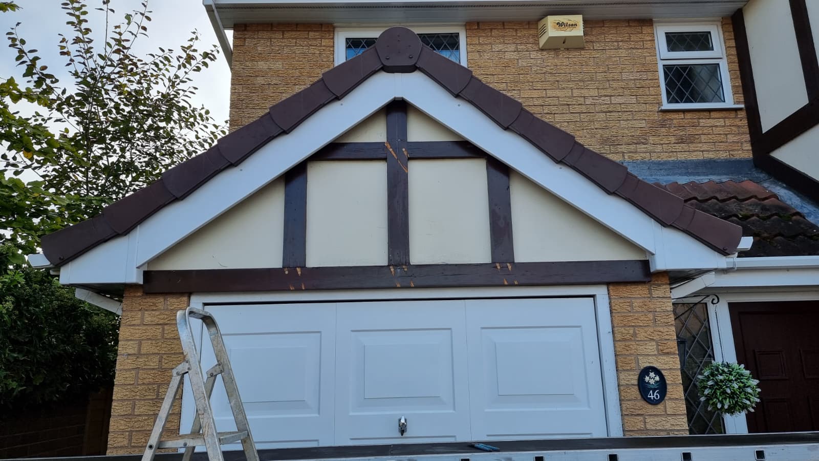 Damaged fascia and soffit boards before replacement