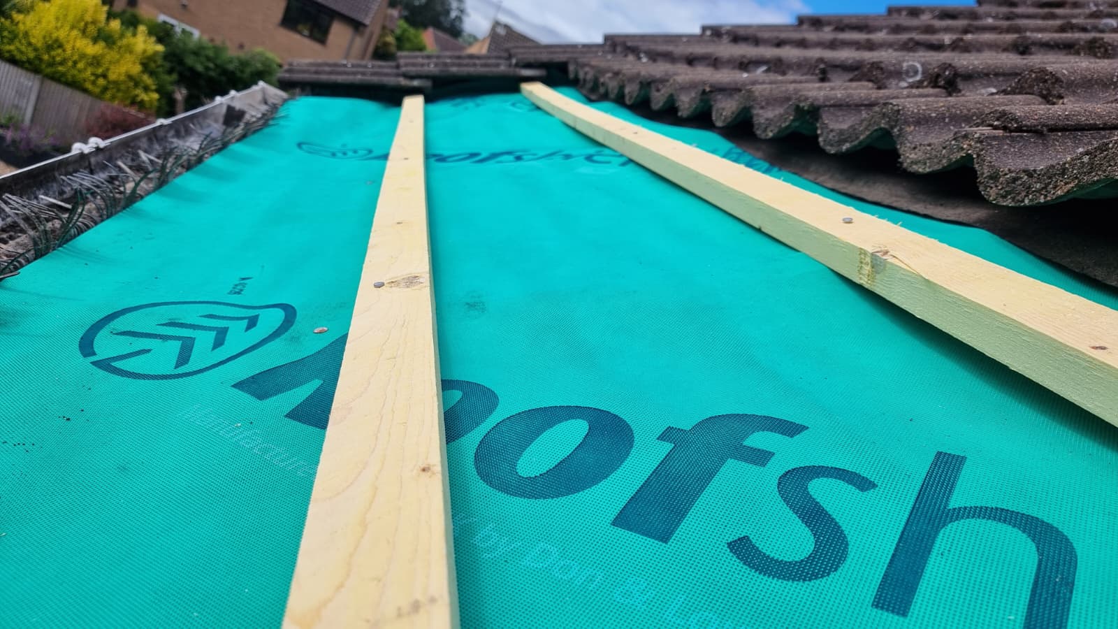 Close-up of new Roofshield breathable membrane with timber battens being fitted