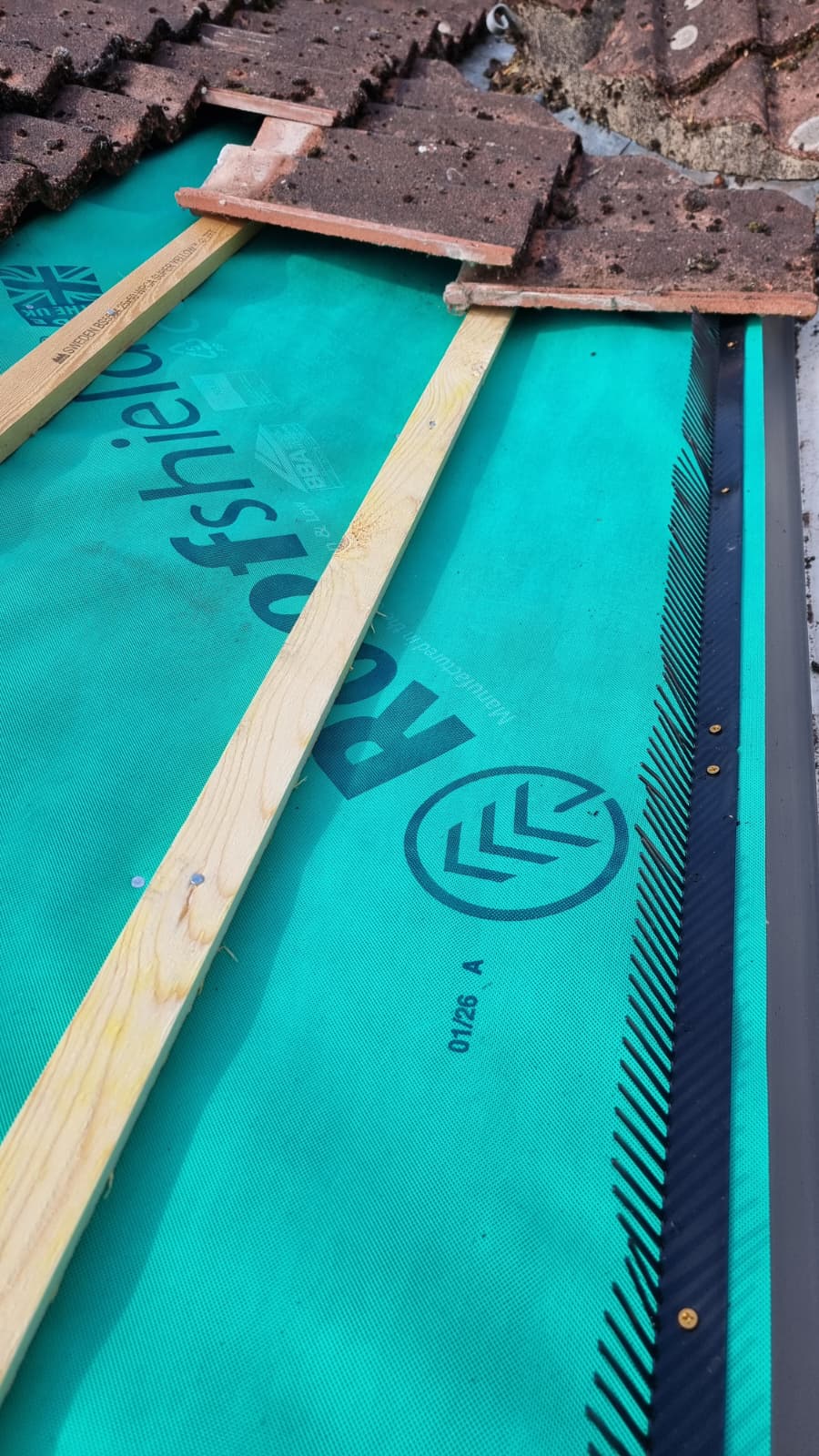 Roofshield membrane and eaves ventilation comb detail on re-roofing project