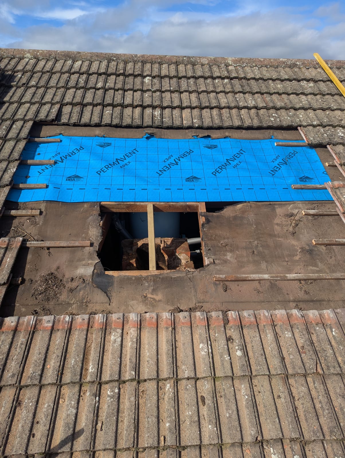 Permavent Apex membrane fitted over opening with water tank visible below